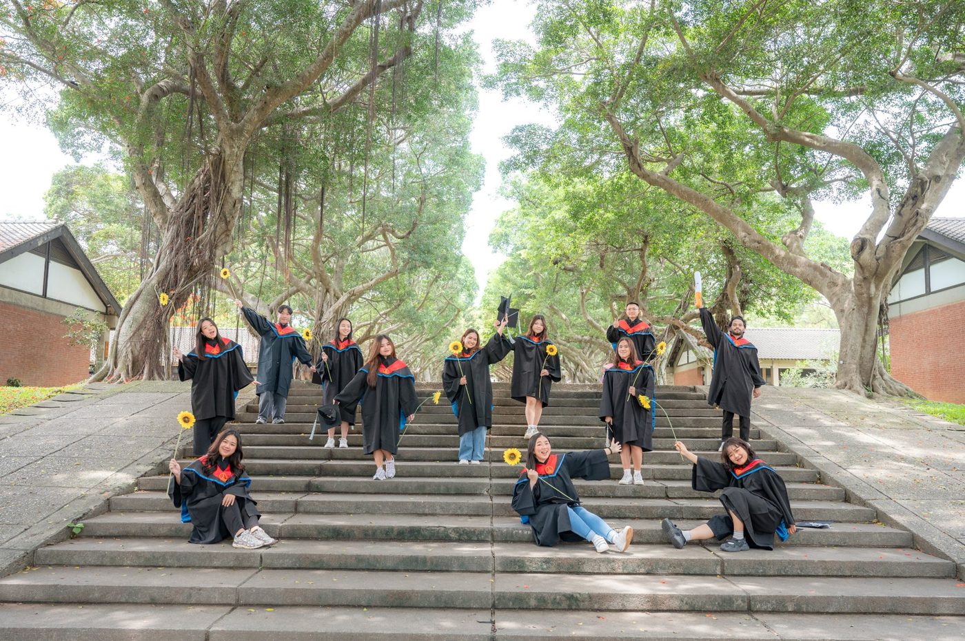 Class of 2026 GMBA graduates took a group photo on the campus's Liberal Arts Boulevard